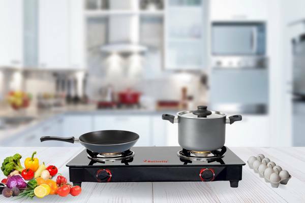 Cooking on Butterfly Smart Glass Top 2 Burner Gas Stove