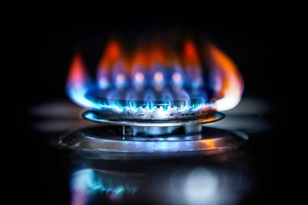 Blue Flame With Orange Tips on Gas Stove